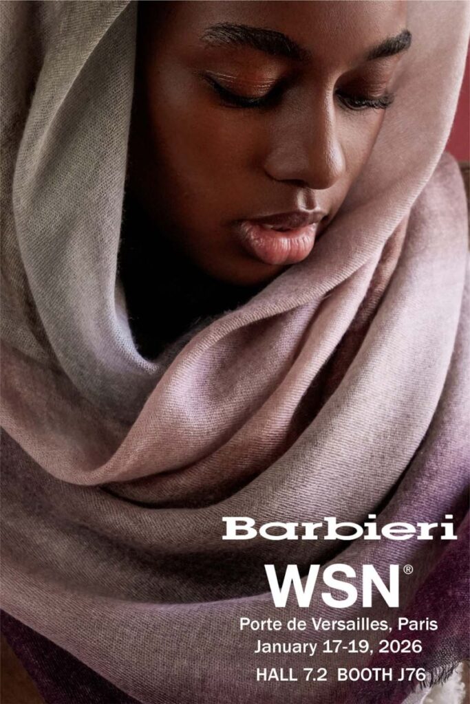 Woman of color wearing a beige headscarf.